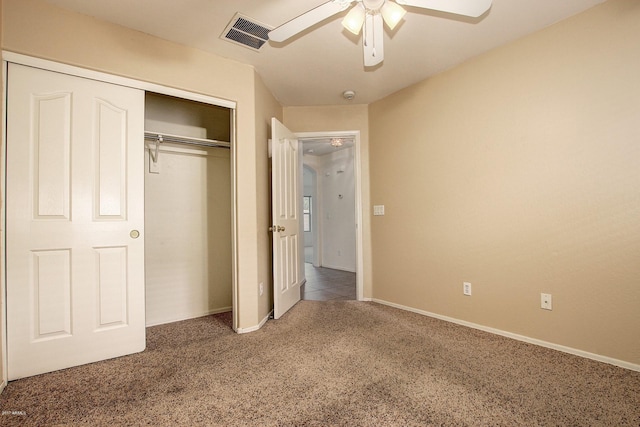 unfurnished bedroom featuring ceiling fan, a closet, and carpet floors