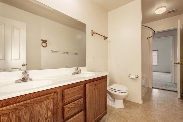 full bathroom featuring washtub / shower combination, vanity, and toilet