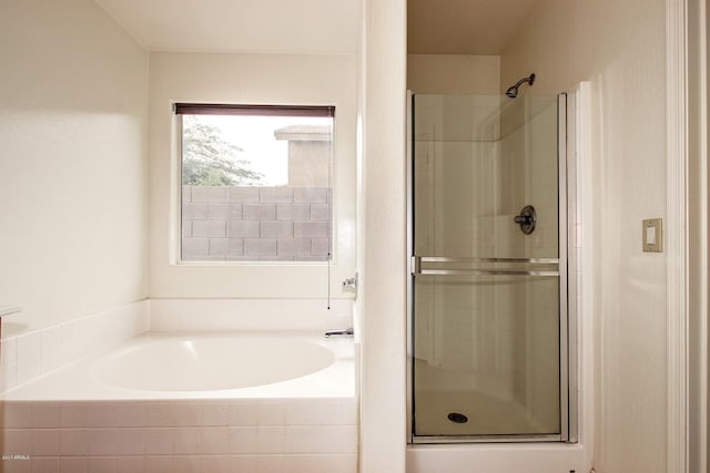 bathroom with separate shower and tub