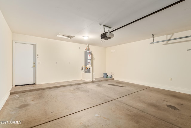 garage featuring water heater and a garage door opener