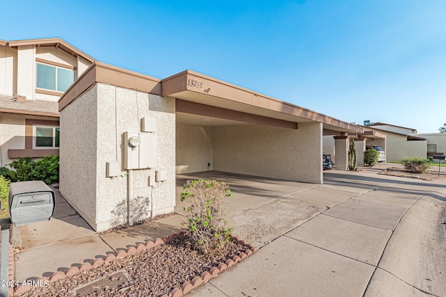 exterior space featuring a carport