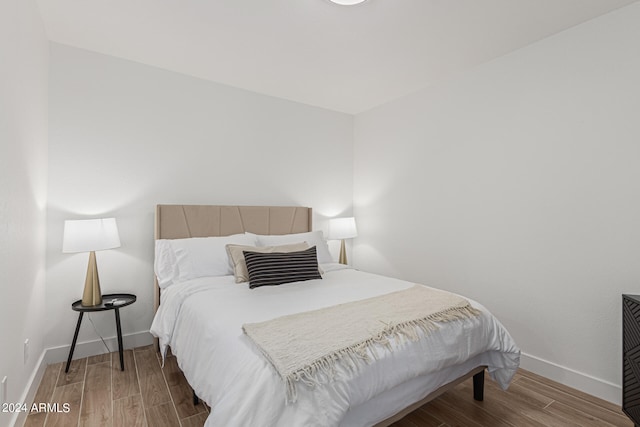 bedroom featuring wood-type flooring