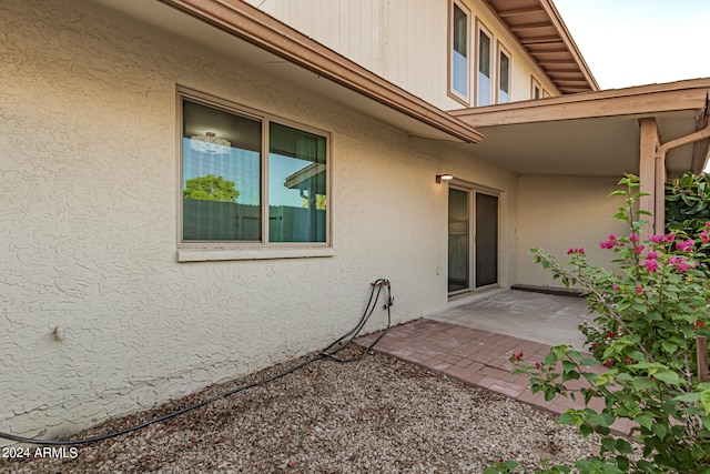 doorway to property with a patio area