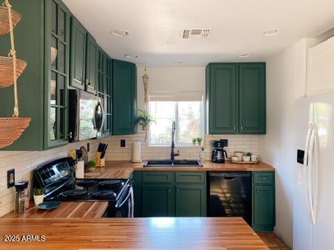 106 W Washington Ave, Gilbert, AZ 85233 - kitchen with green cabinetry, black appliances, a sink, and recessed lighting
