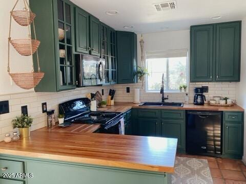 106 W Washington Ave, Gilbert, AZ 85233 - kitchen featuring black appliances, green cabinets, a sink, and decorative backsplash