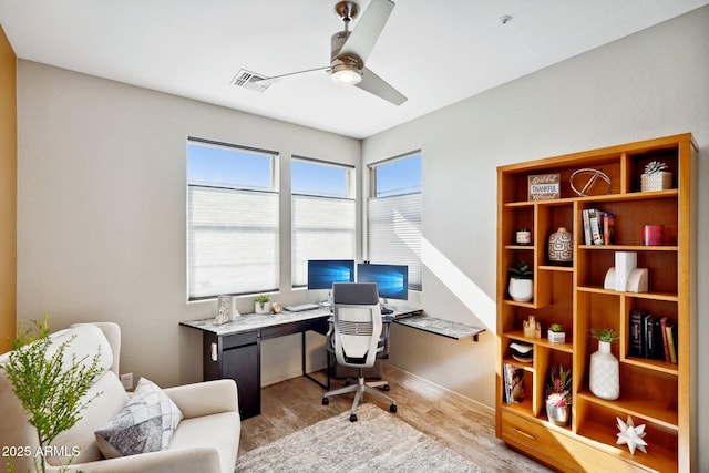 office space with ceiling fan and light hardwood / wood-style floors