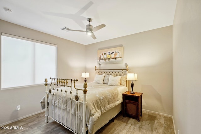 bedroom with ceiling fan and hardwood / wood-style floors