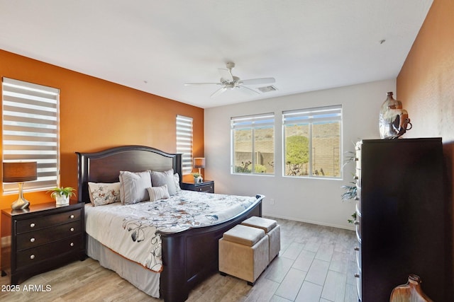 bedroom featuring ceiling fan and light hardwood / wood-style flooring