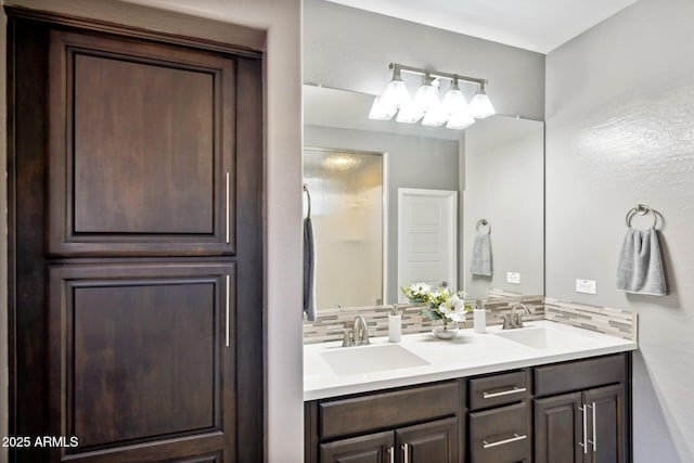 bathroom featuring vanity and backsplash