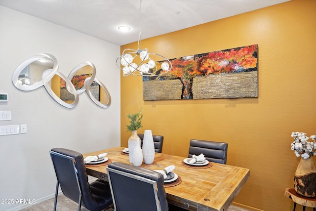 dining area featuring a notable chandelier