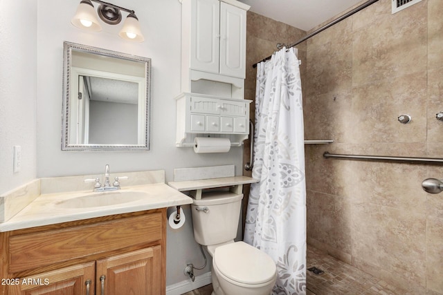 bathroom featuring vanity, a shower with curtain, and toilet