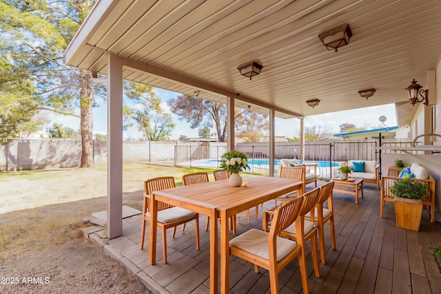 exterior space featuring a fenced in pool and outdoor lounge area