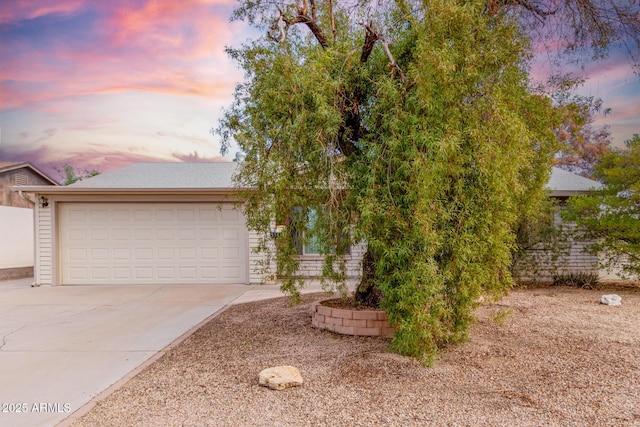 obstructed view of property with a garage