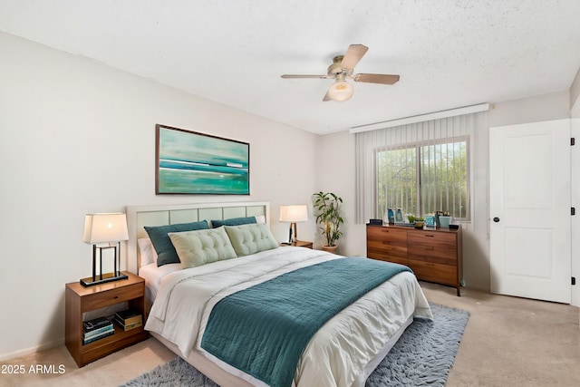 bedroom with ceiling fan and light colored carpet