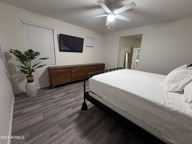 bedroom with ceiling fan and hardwood / wood-style floors