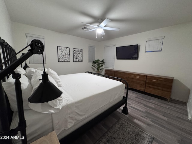 bedroom featuring ceiling fan and dark wood-type flooring