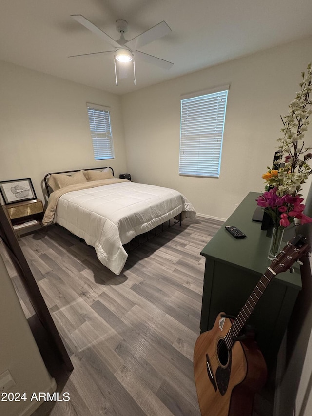 bedroom featuring ceiling fan and hardwood / wood-style floors