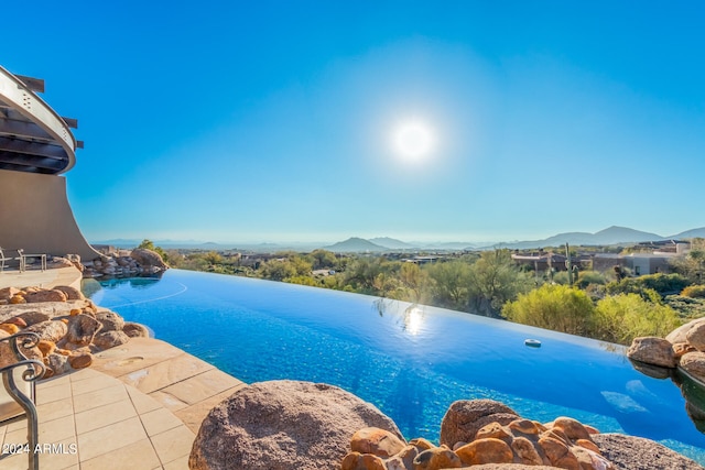 view of pool featuring a mountain view