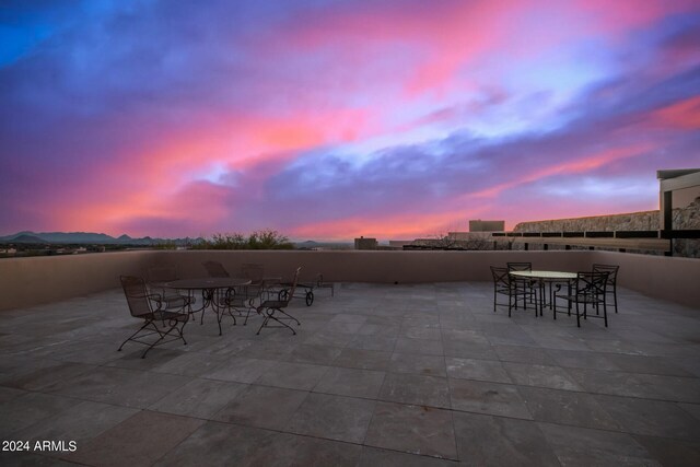 view of patio terrace at dusk