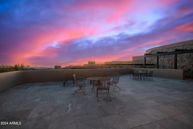 view of patio terrace at dusk