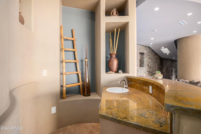 bathroom featuring vanity and a bathing tub