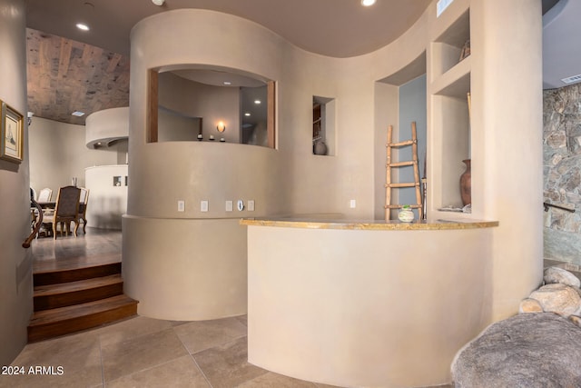 hallway with light tile flooring