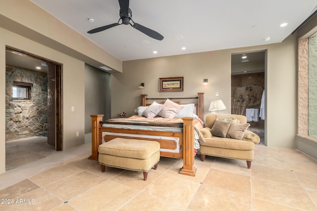 tiled bedroom featuring ceiling fan