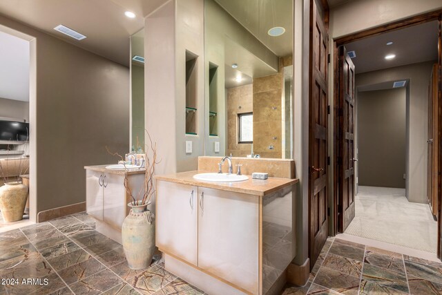 bathroom featuring tile flooring and vanity