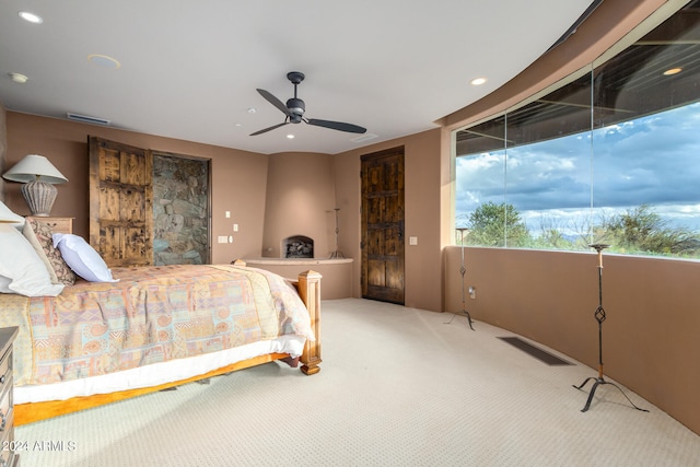 carpeted bedroom featuring ceiling fan