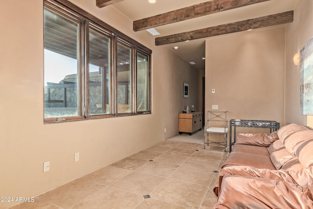 tiled living room with beam ceiling