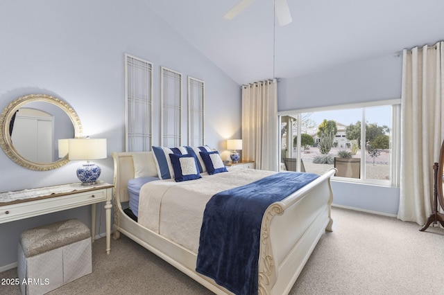 bedroom with ceiling fan, light colored carpet, and vaulted ceiling