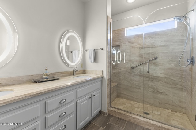 bathroom with vanity and an enclosed shower