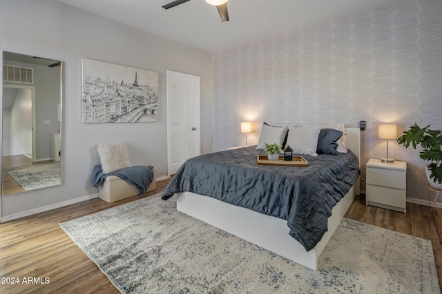 bedroom featuring ceiling fan and hardwood / wood-style flooring