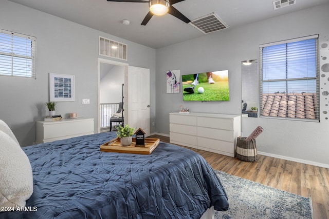 bedroom with ceiling fan and hardwood / wood-style floors