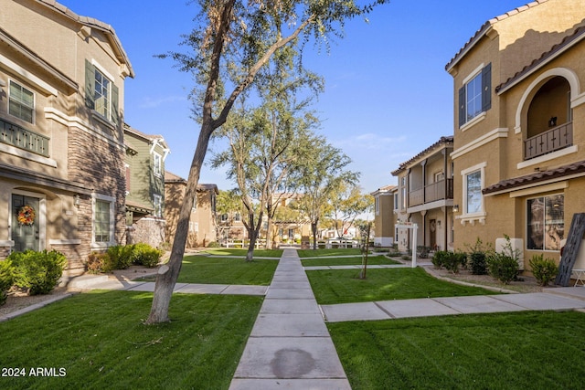 surrounding community with a lawn