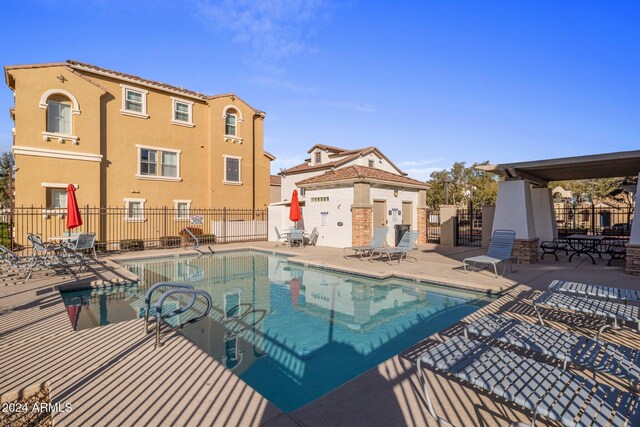 view of swimming pool with a patio