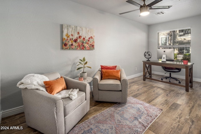 office space with ceiling fan and dark hardwood / wood-style flooring