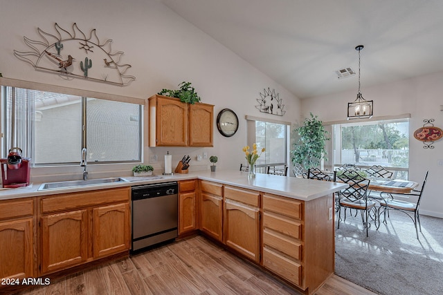 kitchen with sink, stainless steel dishwasher, plenty of natural light, light hardwood / wood-style floors, and kitchen peninsula