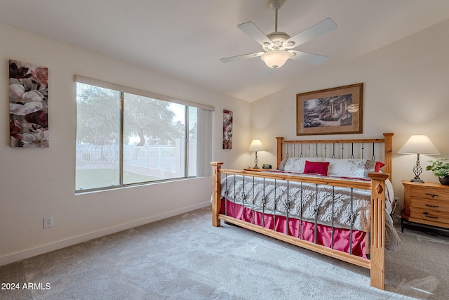 carpeted bedroom featuring ceiling fan and lofted ceiling