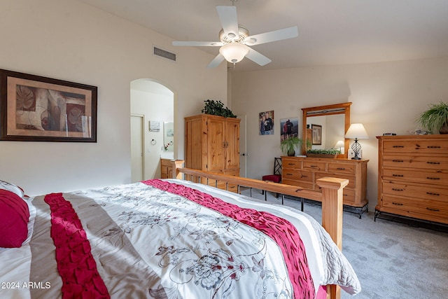 carpeted bedroom featuring ceiling fan and lofted ceiling