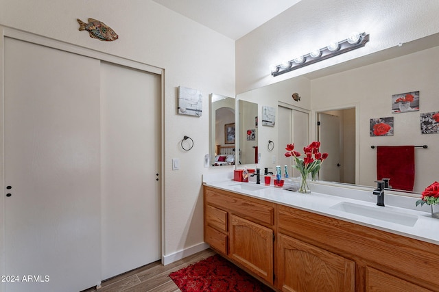 bathroom featuring vanity and hardwood / wood-style flooring