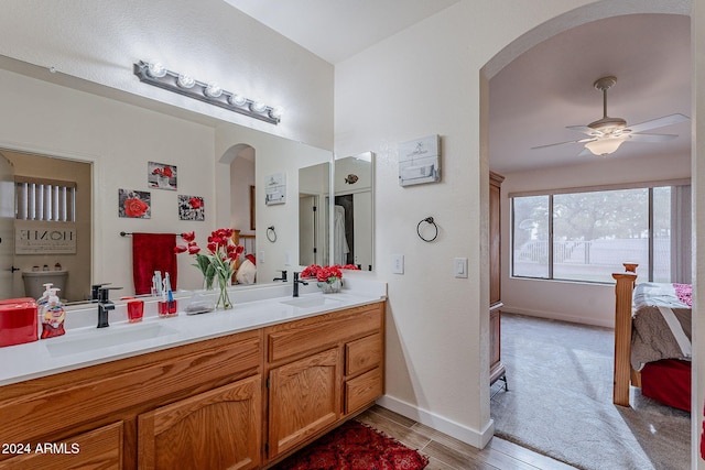 bathroom featuring ceiling fan, vanity, and hardwood / wood-style flooring