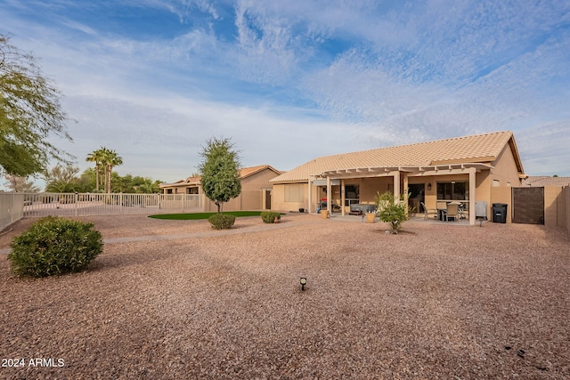 rear view of property featuring a patio