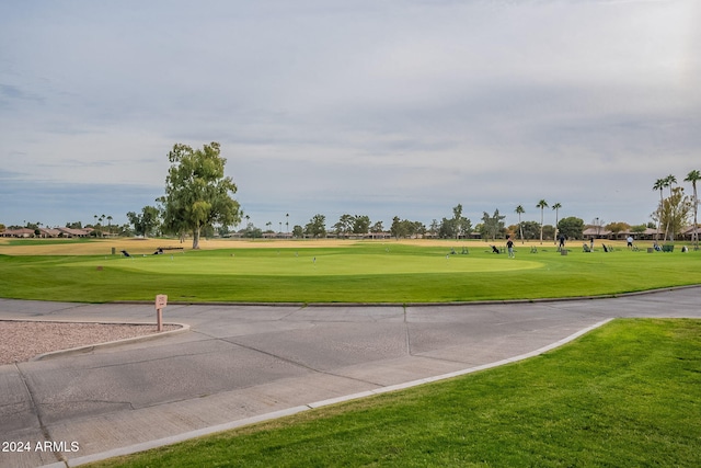 surrounding community featuring a lawn