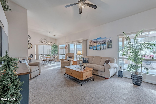 living room featuring carpet flooring, vaulted ceiling, and ceiling fan