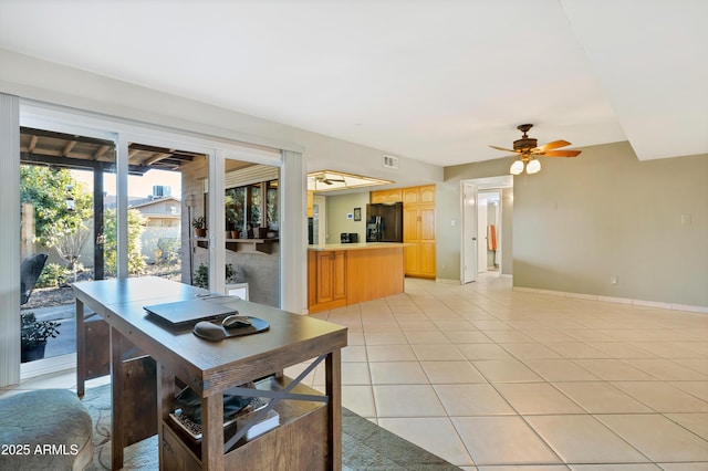 dining area featuring light tile patterned flooring and ceiling fan