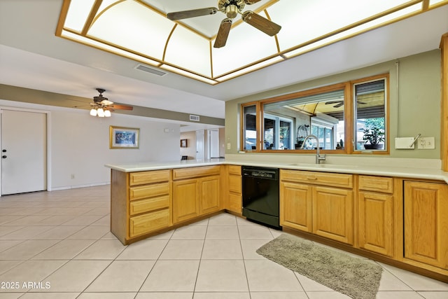 kitchen with light tile patterned flooring, black dishwasher, sink, ceiling fan, and kitchen peninsula