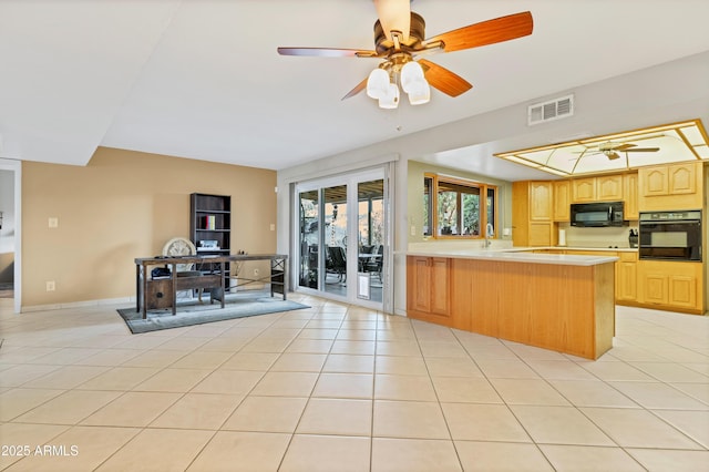 kitchen with black appliances, light tile patterned floors, ceiling fan, kitchen peninsula, and light brown cabinets