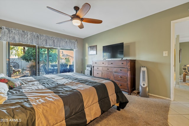 tiled bedroom with ceiling fan and access to outside