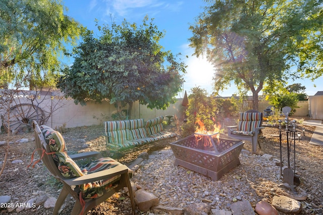 view of yard with a fire pit